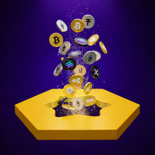 Various crypto coins resting on a dark reflective surface